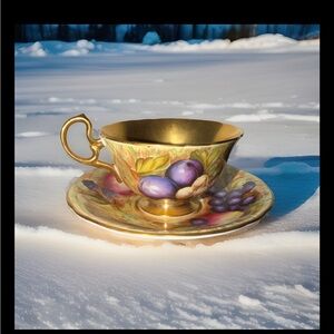 Elegant Gold and Purple Ceramic Teacup and Saucer